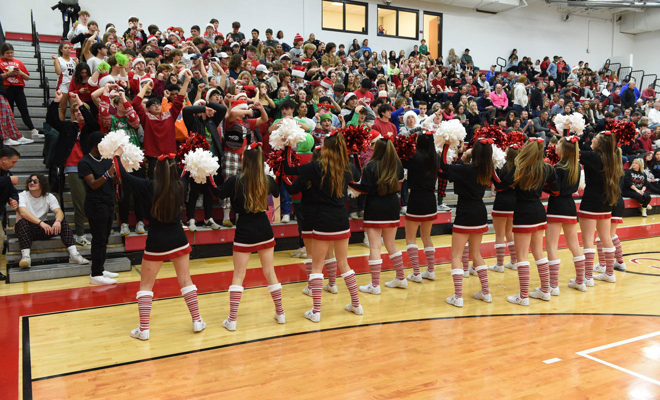 Cheerleaders and crowd at basketball game