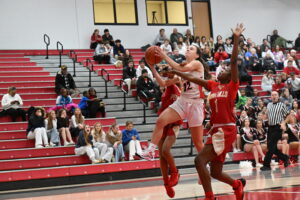 Female basketball player making a layup